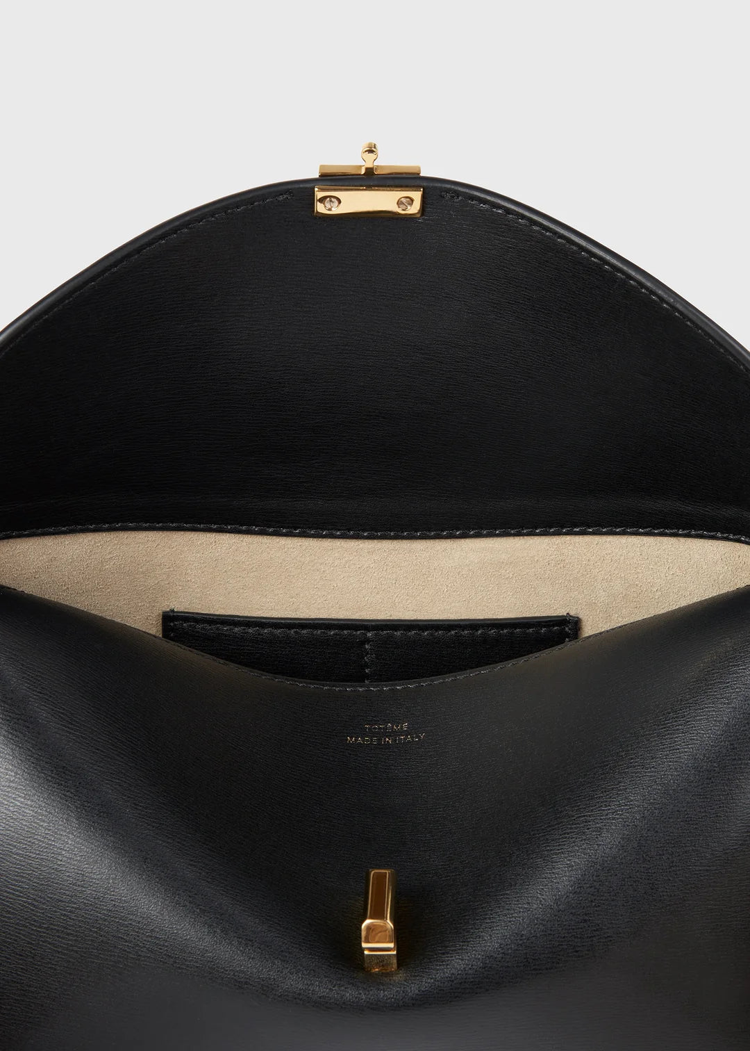 Toteme T-Lock Leather Clutch in Black