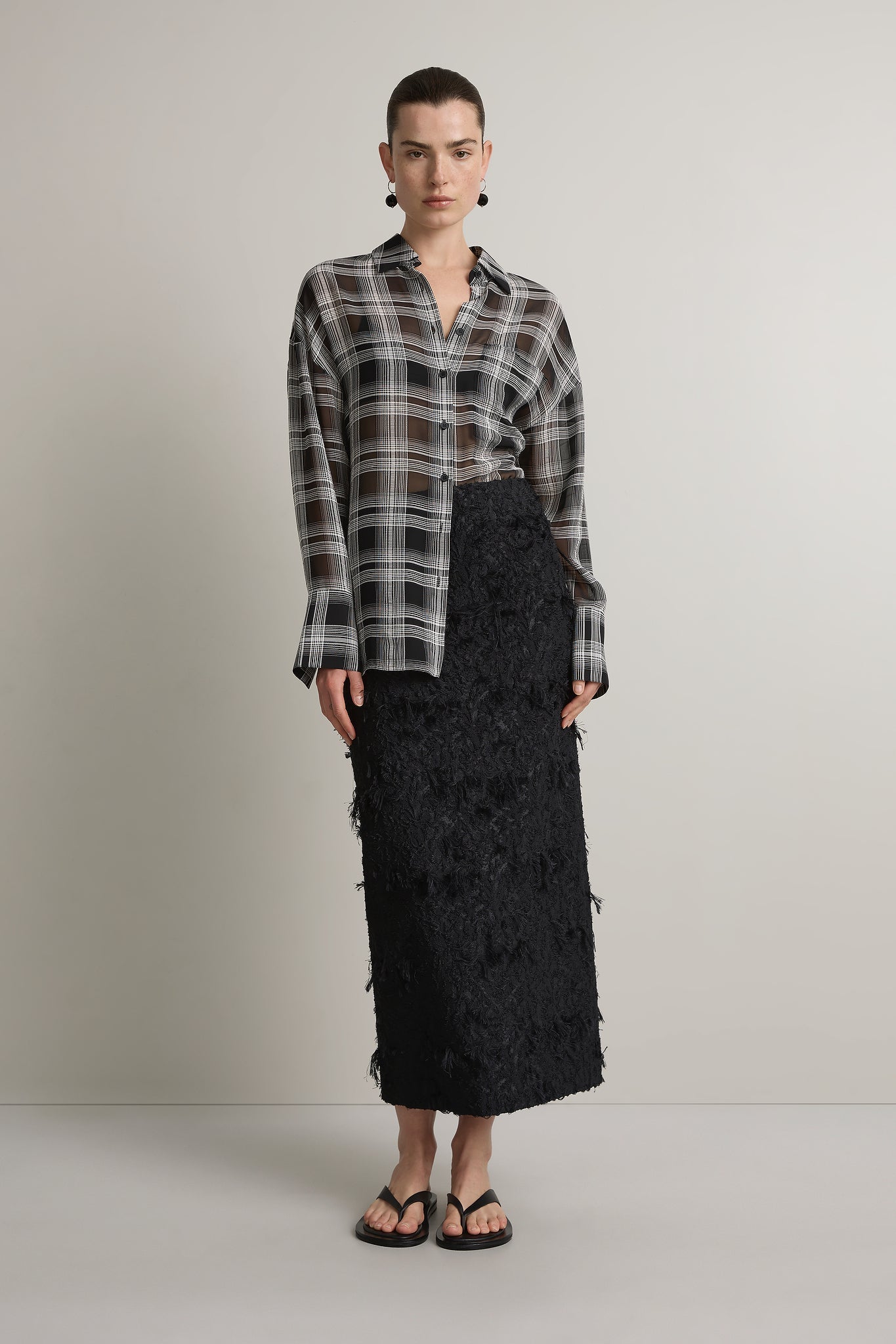 A Emery Joyse Sheer Shirt in Black And White Check - side view