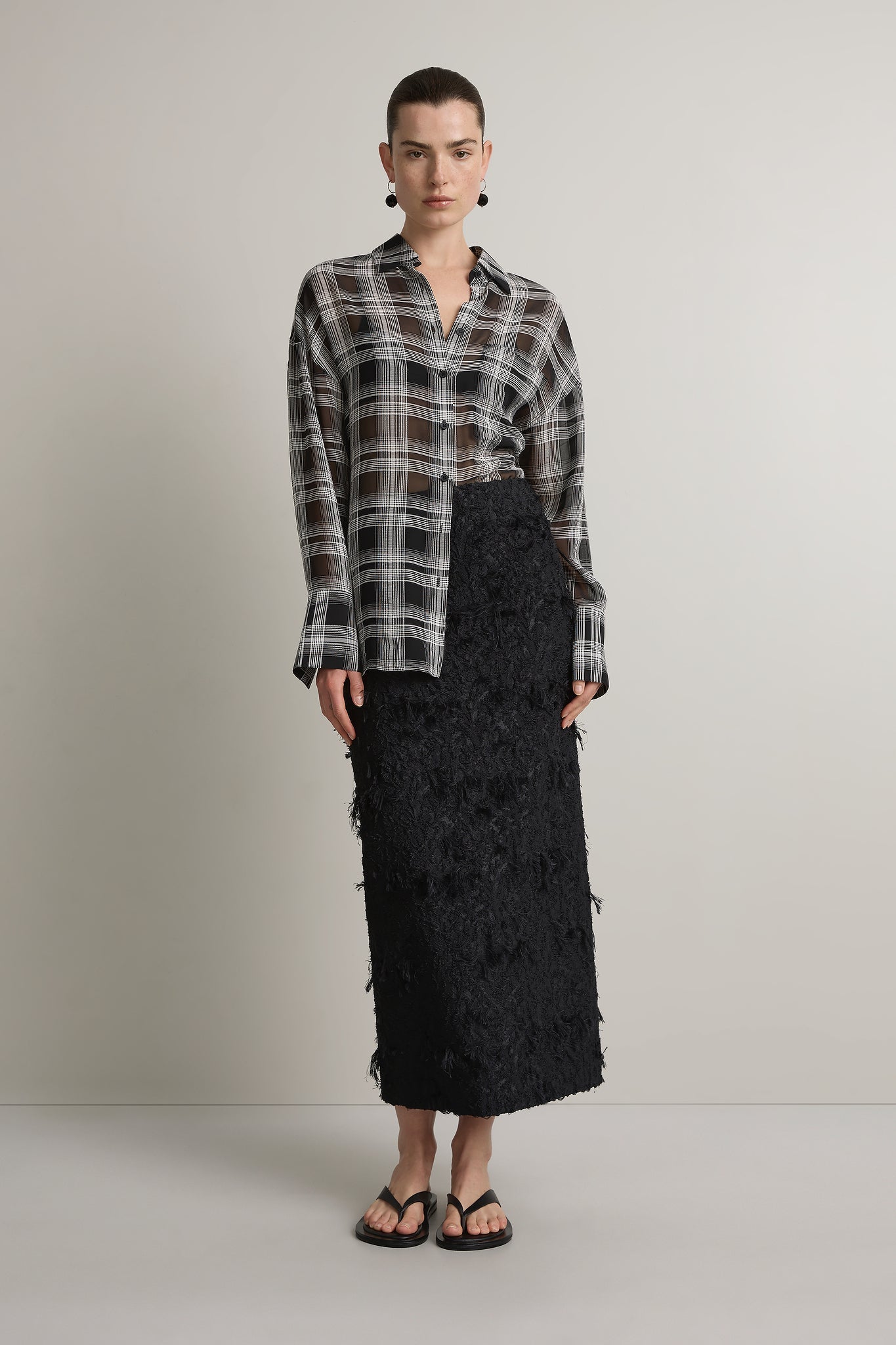 A Emery Joyse Sheer Shirt in Black And White Check - side view
