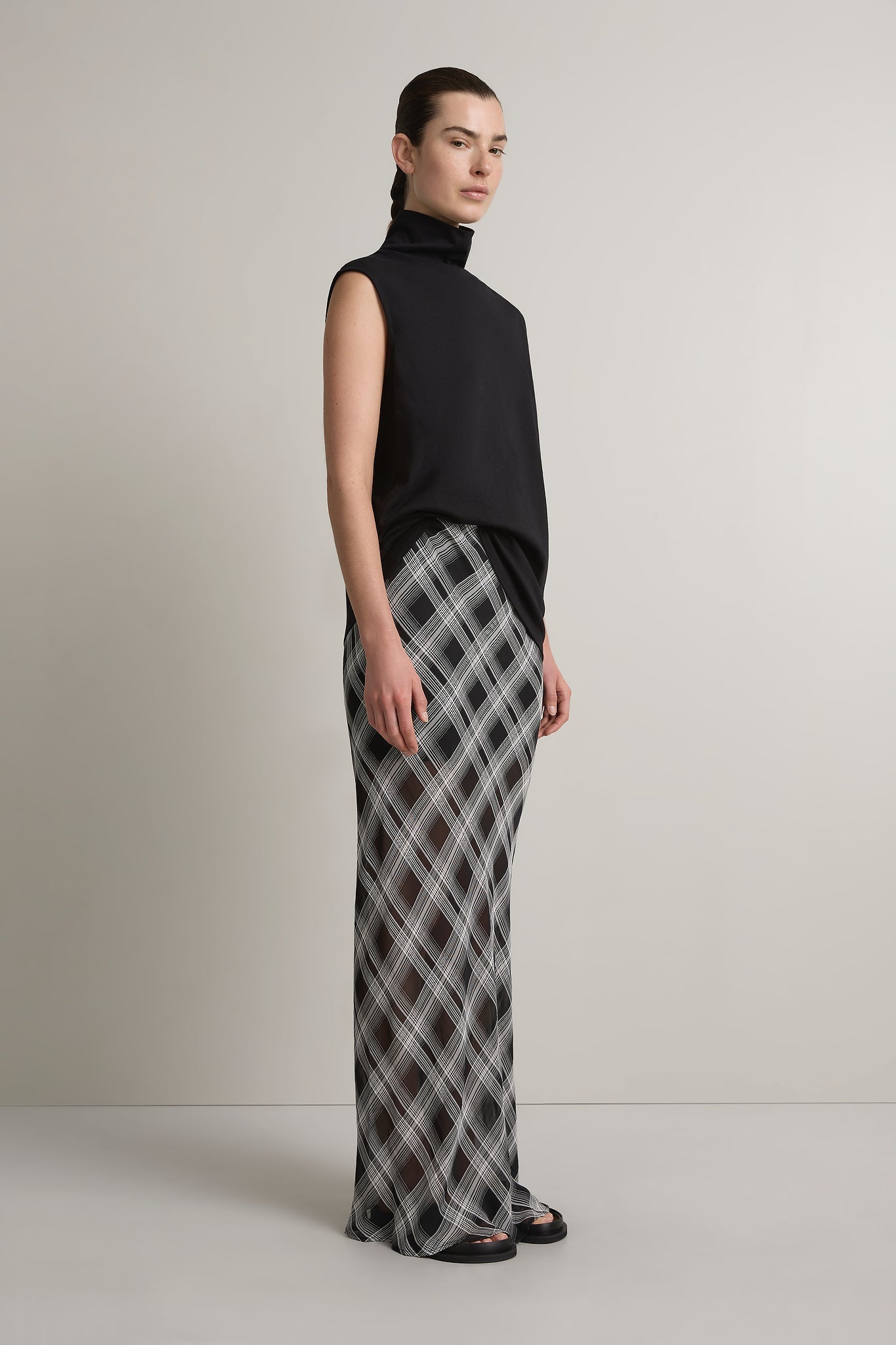 A Emery Miles Sleeveless Top in Black - side view