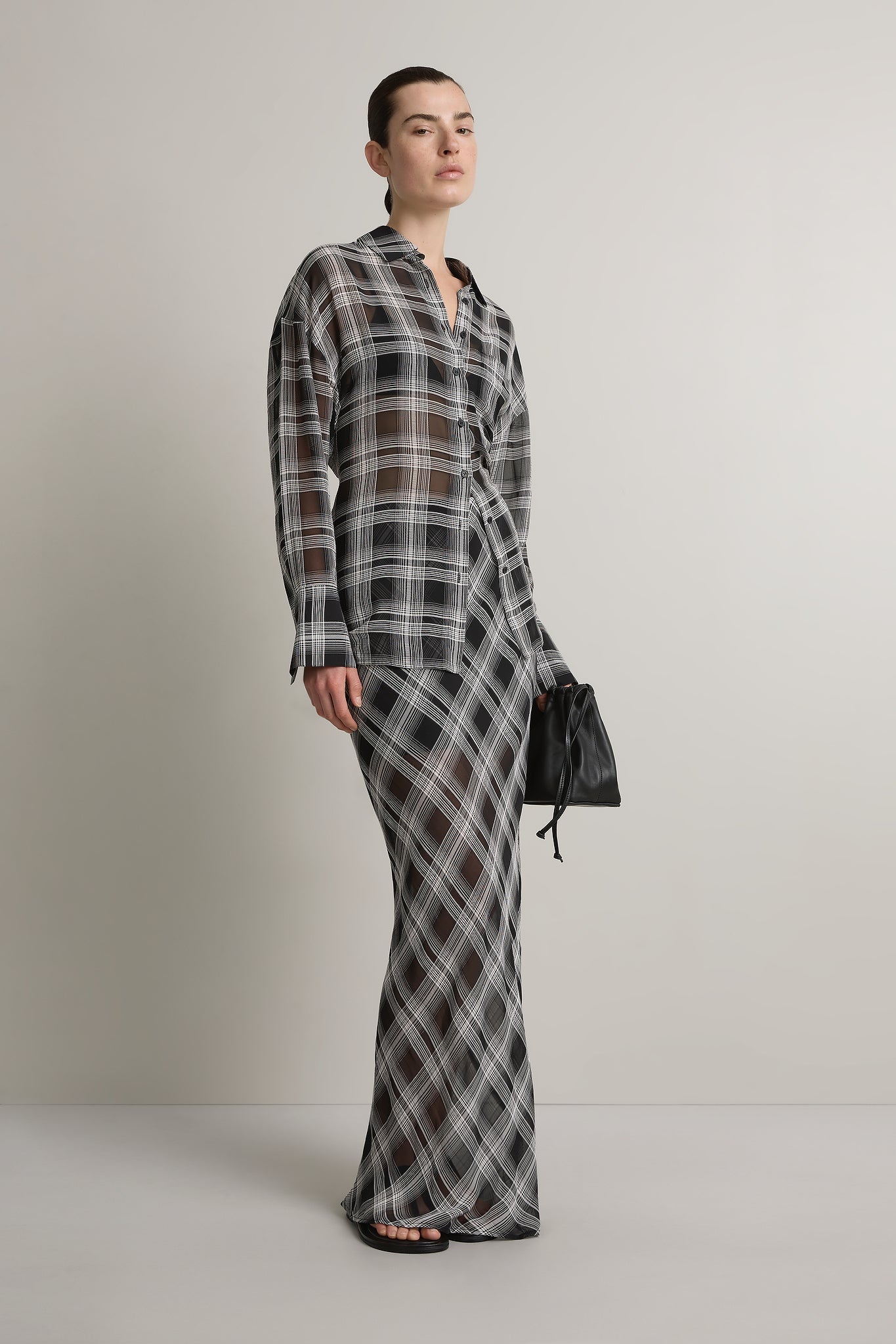 A Emery Reese Sheer Skirt in Black And White Check - side view