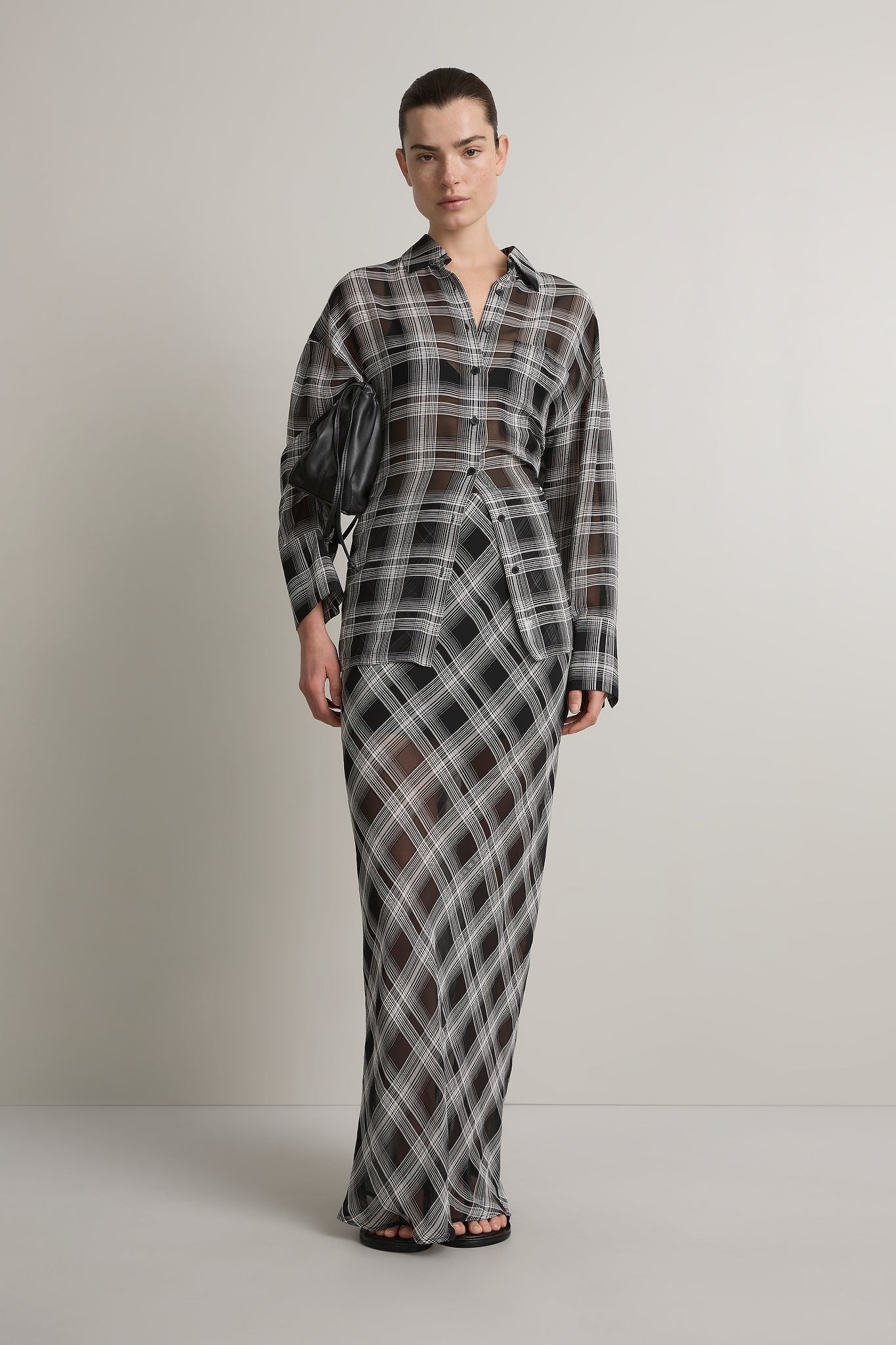 A Emery Reese Sheer Skirt in Black And White Check - detail view