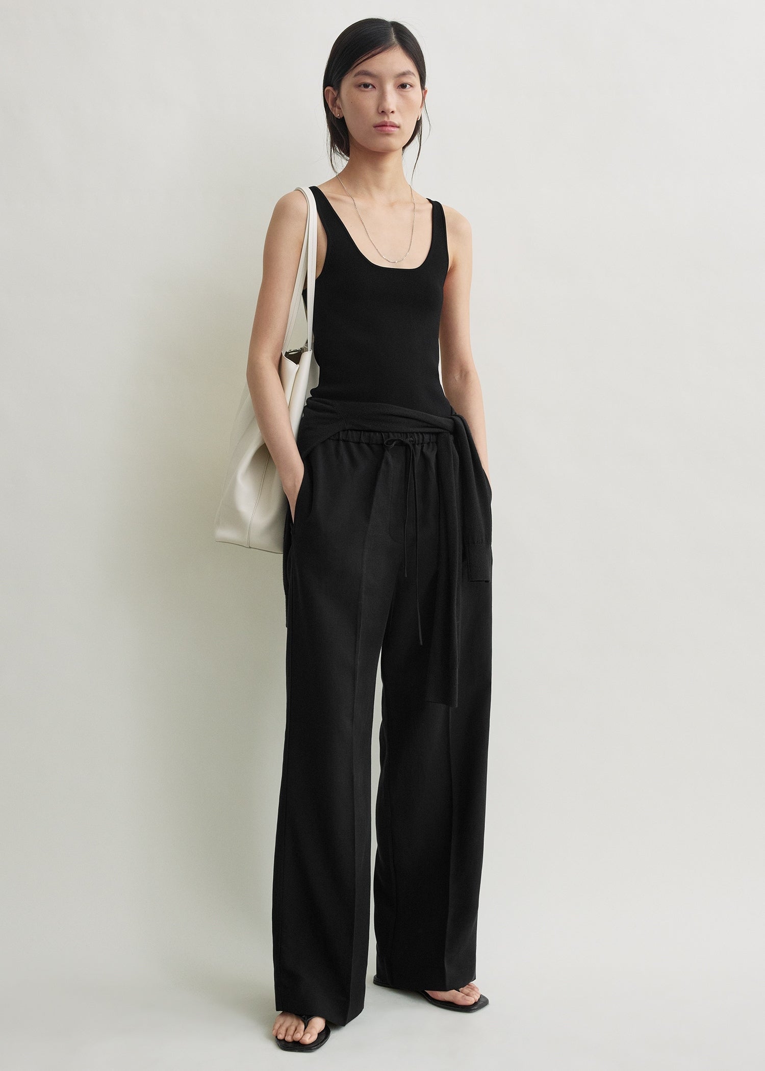 Toteme Drawstring Cotton Trousers in Black - side view
