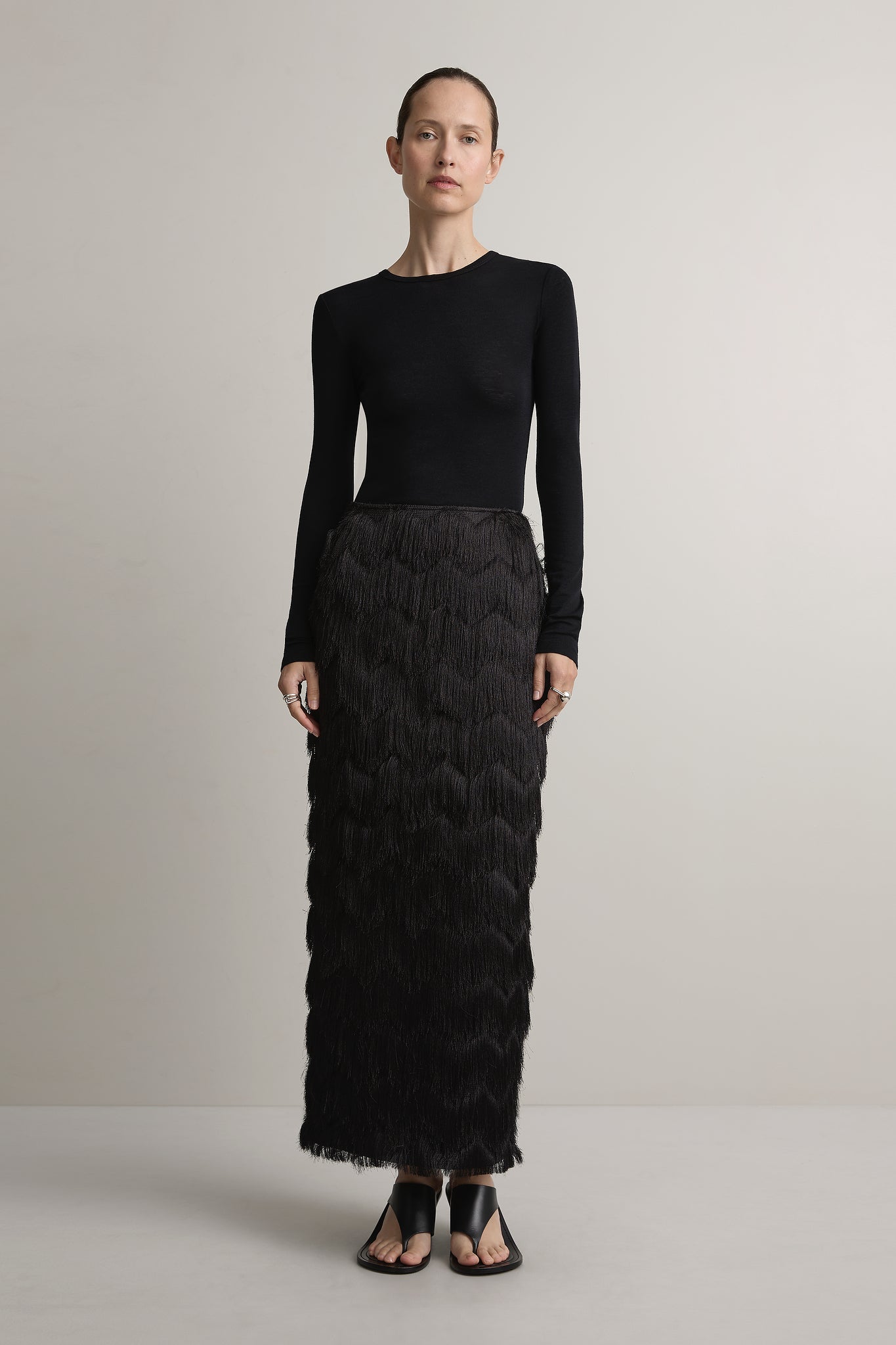 A Emery Innes Fringed Skirt in Black - side view