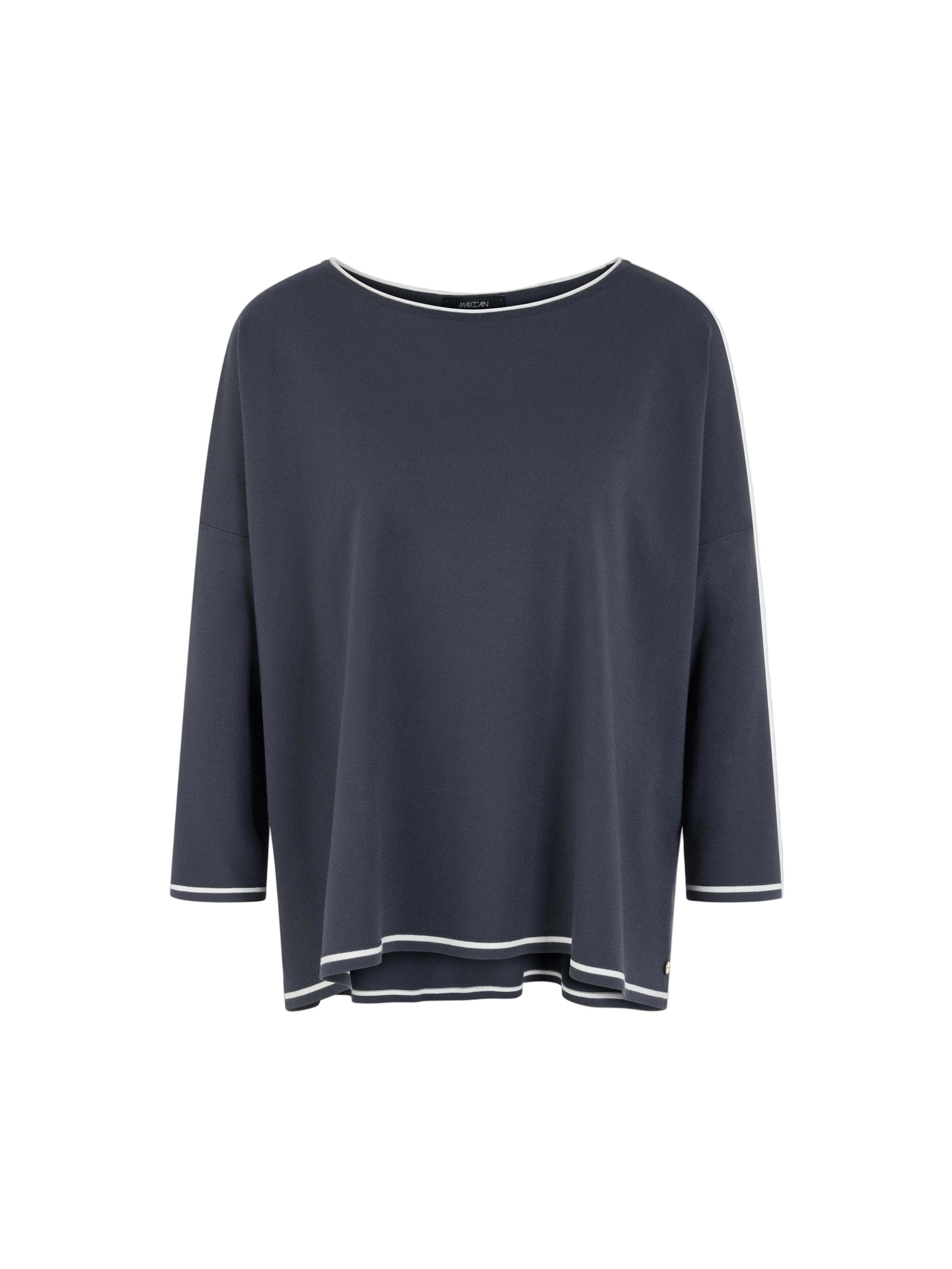 A dark navy blue long-sleeve top with white contrast trim along the neckline, cuffs, and hem, displayed against a light gray background.