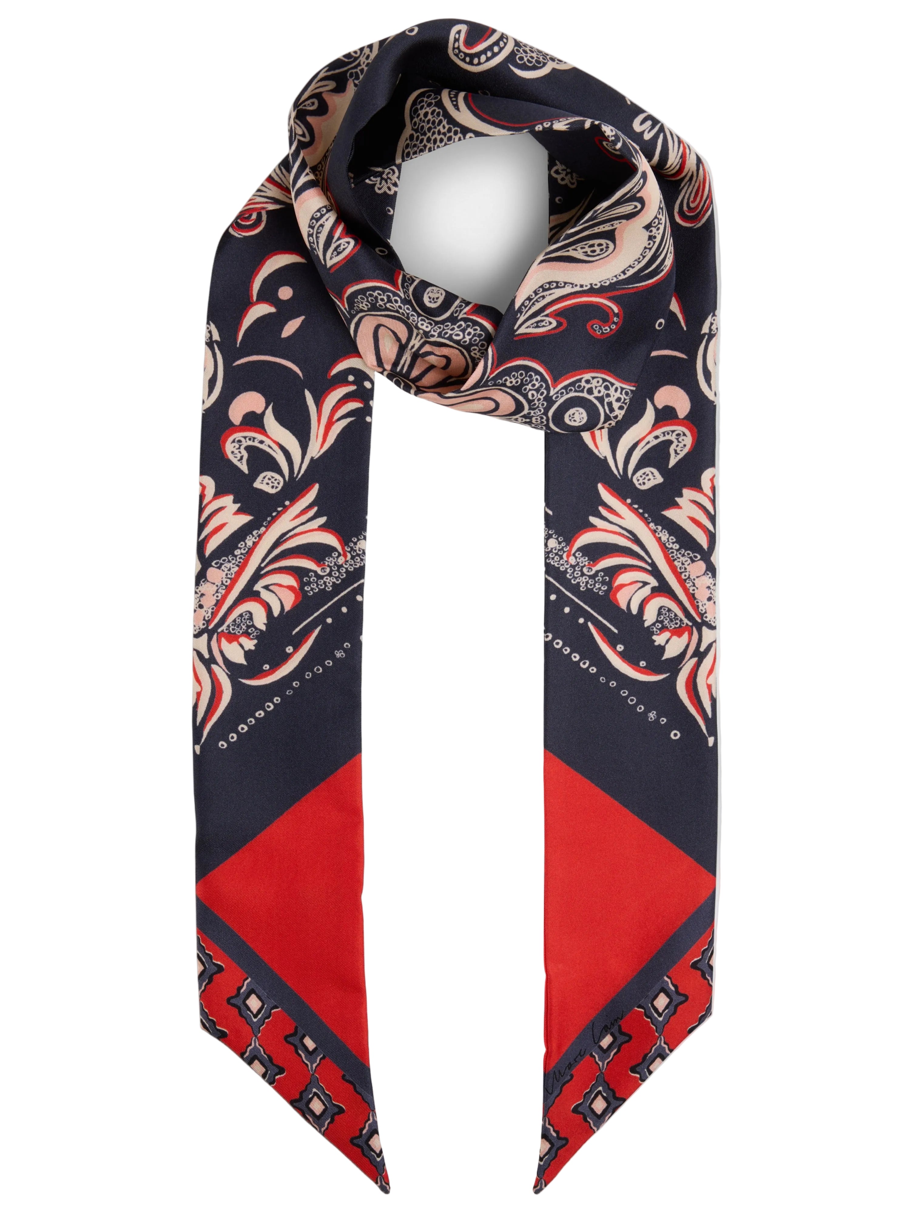 A silk scarf with a navy blue base, featuring a detailed beige and red paisley pattern on the top and a solid red geometric pattern on the bottom, displayed on a light gray background.