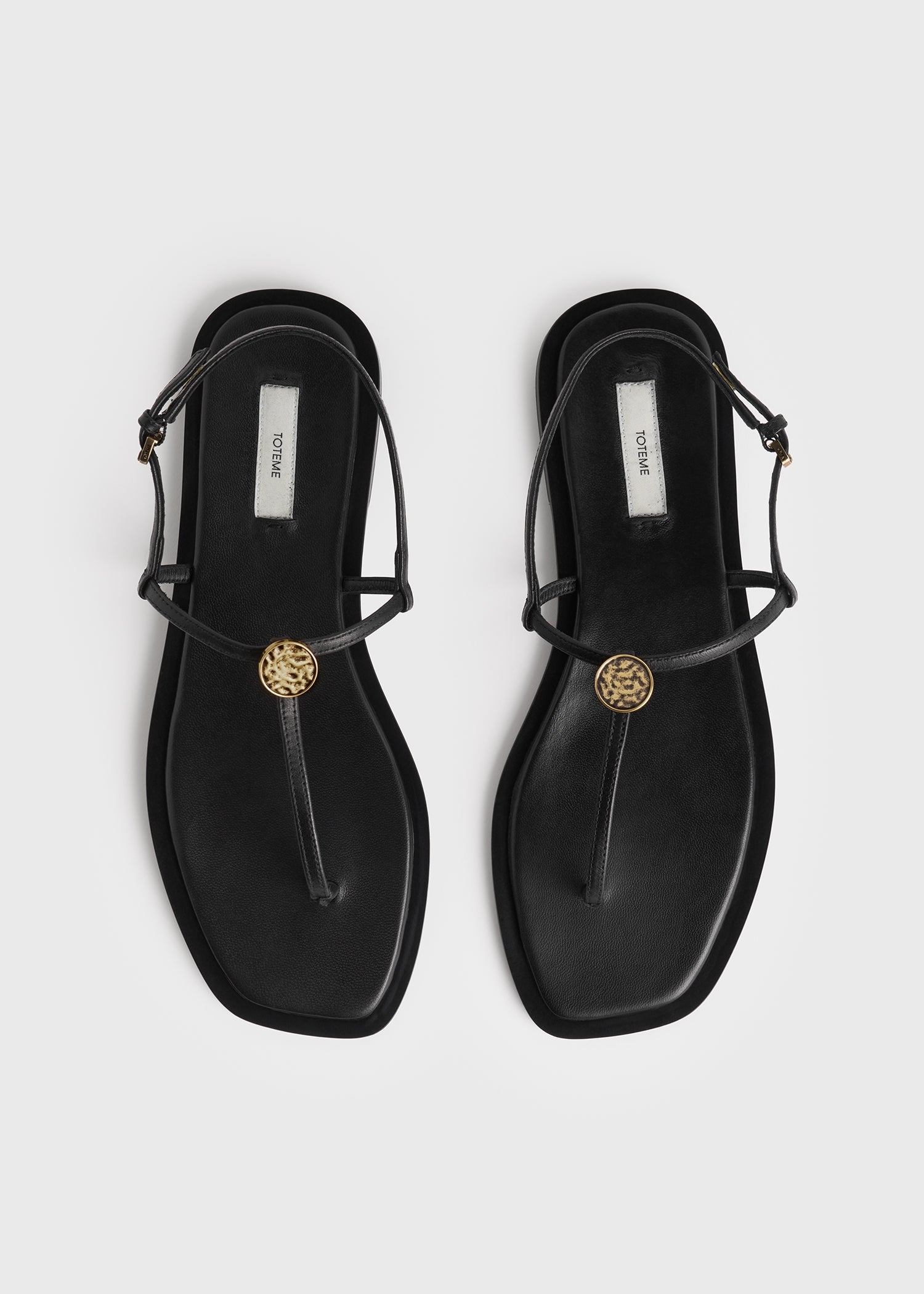 Toteme T-Strap Nappa Sandals in Black - outfit inspiration
