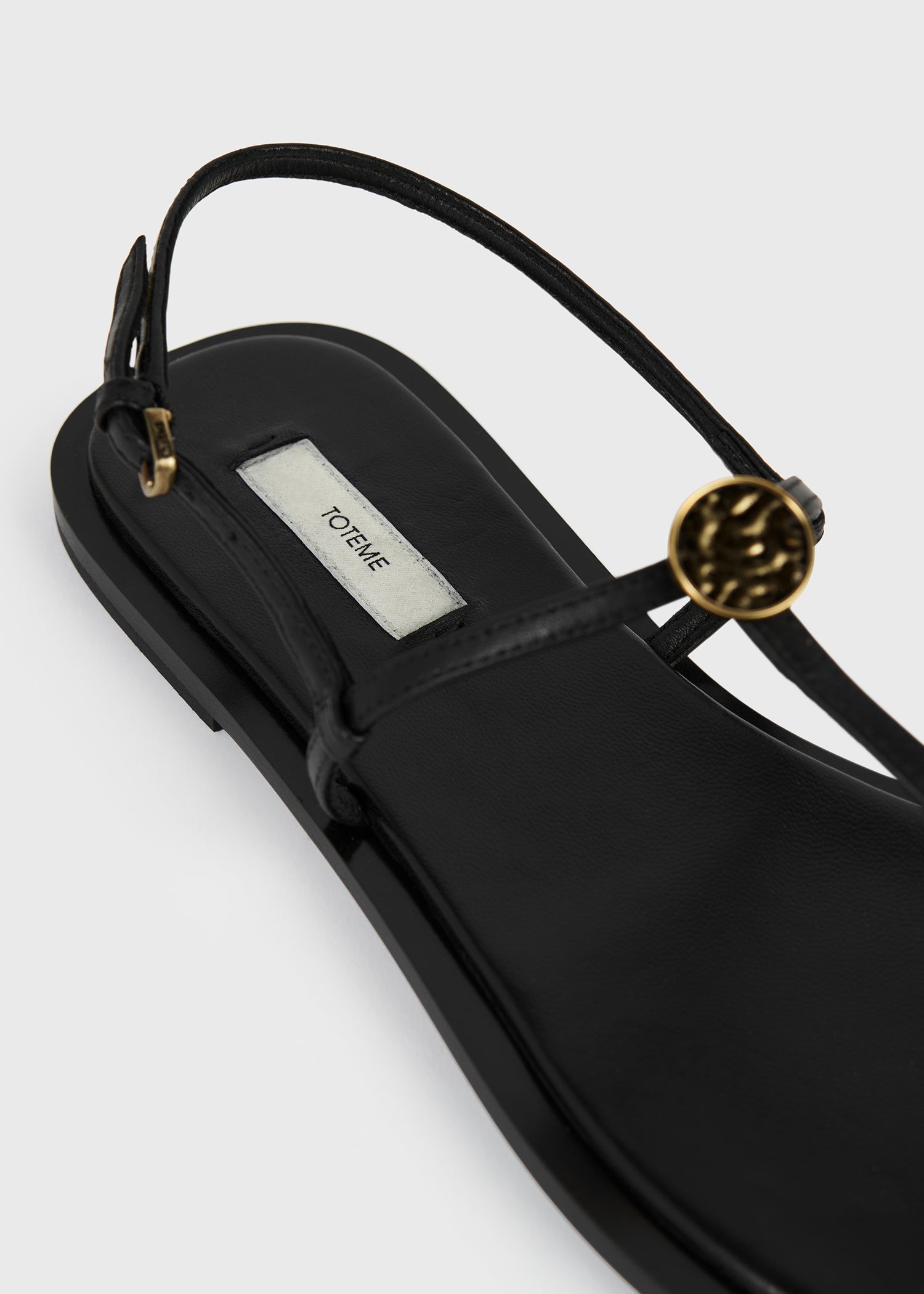 Toteme T-Strap Nappa Sandals in Black - close up