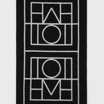 Toteme Monogram Beach Towel in Black and Tofu