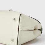 Toteme T-Lock Grained Leather Clutch in Milk