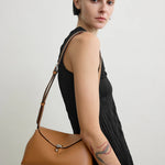 Toteme T-Lock Grained Leather Clutch in Tan