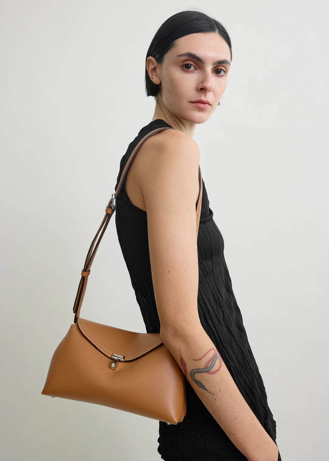 Toteme T-Lock Grained Leather Clutch in Tan
