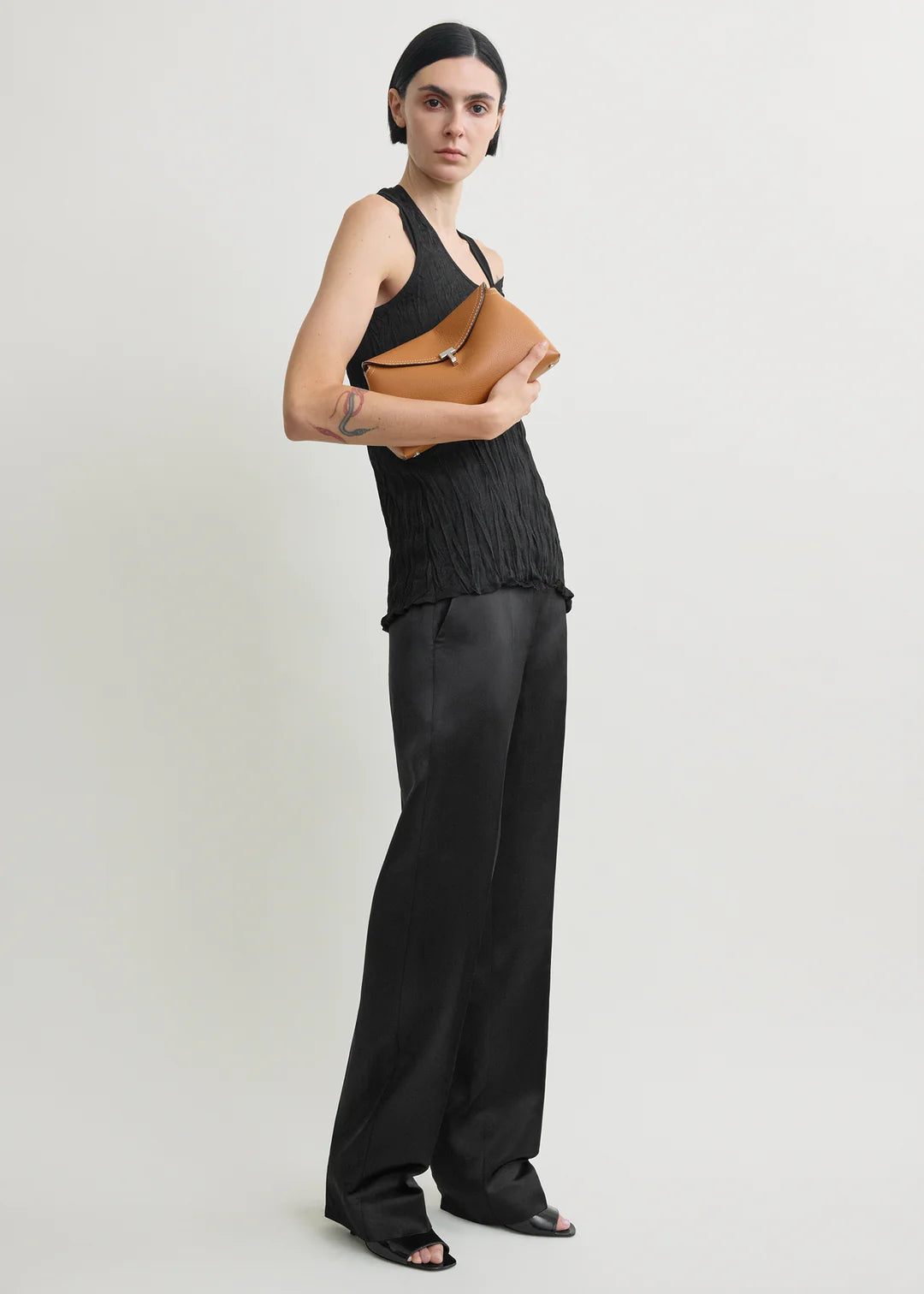 Toteme T-Lock Grained Leather Clutch in Tan