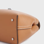Toteme T-Lock Grained Leather Clutch in Tan