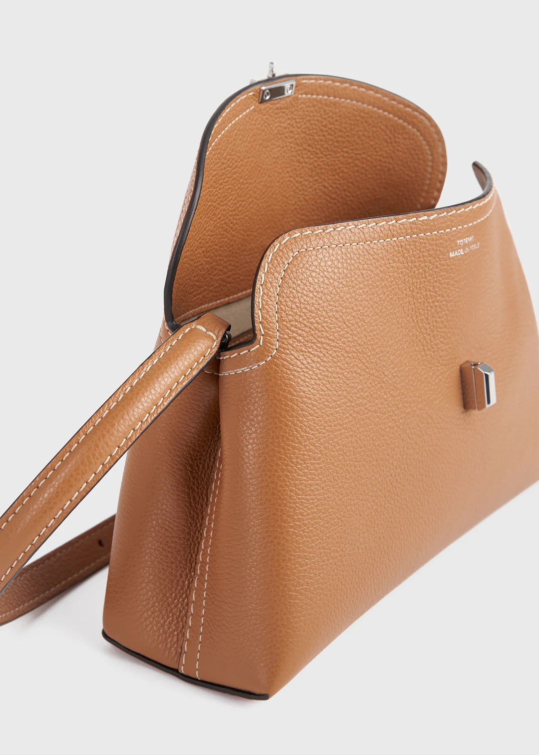 Toteme T-Lock Grained Leather Clutch in Tan