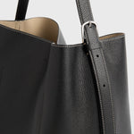 Toteme Medium Belted Grained-Leather Tote in Black - styled look