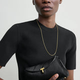 Toteme Mini T-Lock Pony Hair Clutch in Black