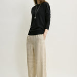 Toteme Monogram Silk PJ Bottoms in Ivory - styled look