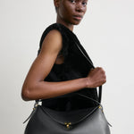 Toteme T-Lock Leather Top Handle in Black - detail view