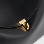 Toteme T-Lock Leather Top Handle in Black - close up
