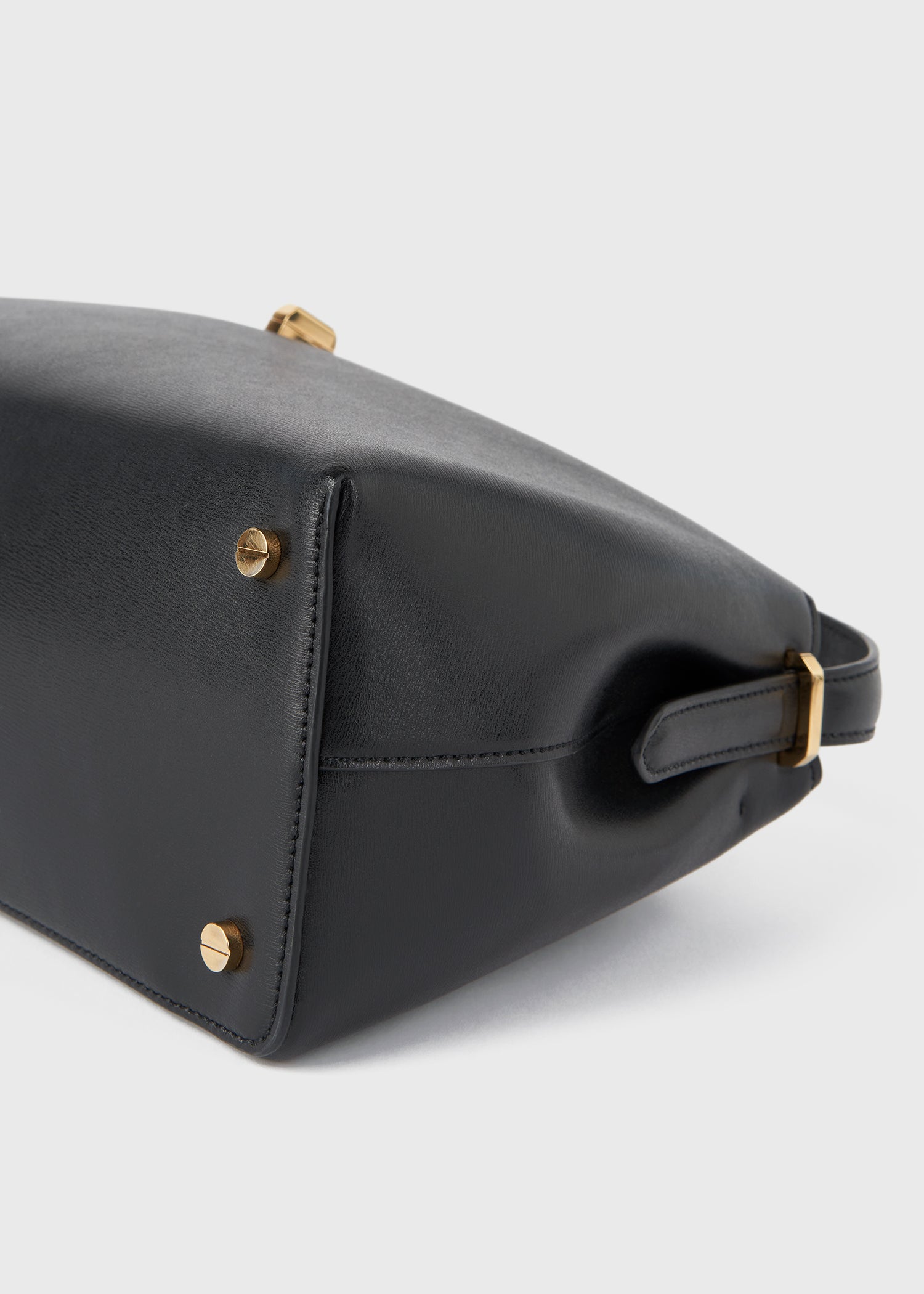 Toteme T-Lock Leather Top Handle in Black - close up