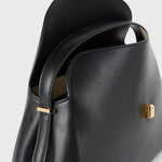 Toteme T-Lock Leather Top Handle in Black - outfit inspiration