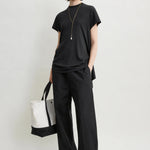 Toteme Drawstring Cotton Trousers in Black - side view