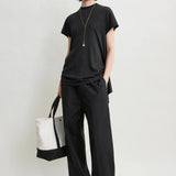 Toteme Drawstring Cotton Trousers in Black - side view