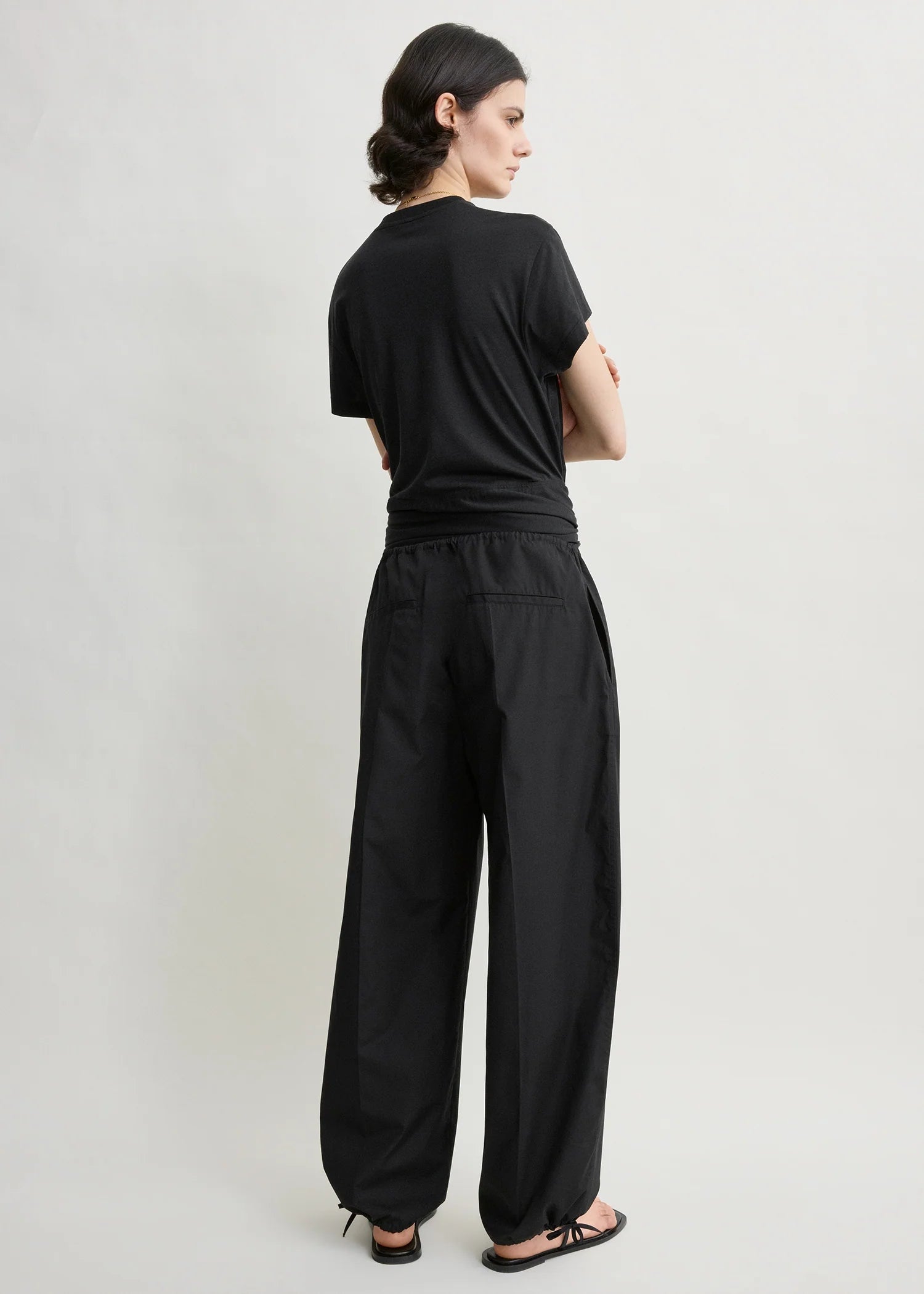 Toteme Drawstring Cotton Trousers in Black - detail view
